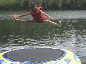 Human Hover Craft - Photo of girl doing the splits 4 feet high over water